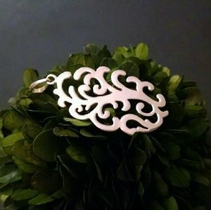 Barse sterling silver scroll pendant.